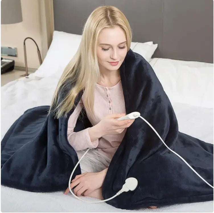 Kavon electric heated blanket measuring 50x60 inches with adjustable temperature and 3 safety levels, shown folded.