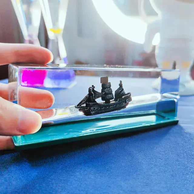 Kavon Prem Fluid Drift bottle cruise ship desk decor with acrylic ocean vibe, perfect for home or office decor enthusiasts.