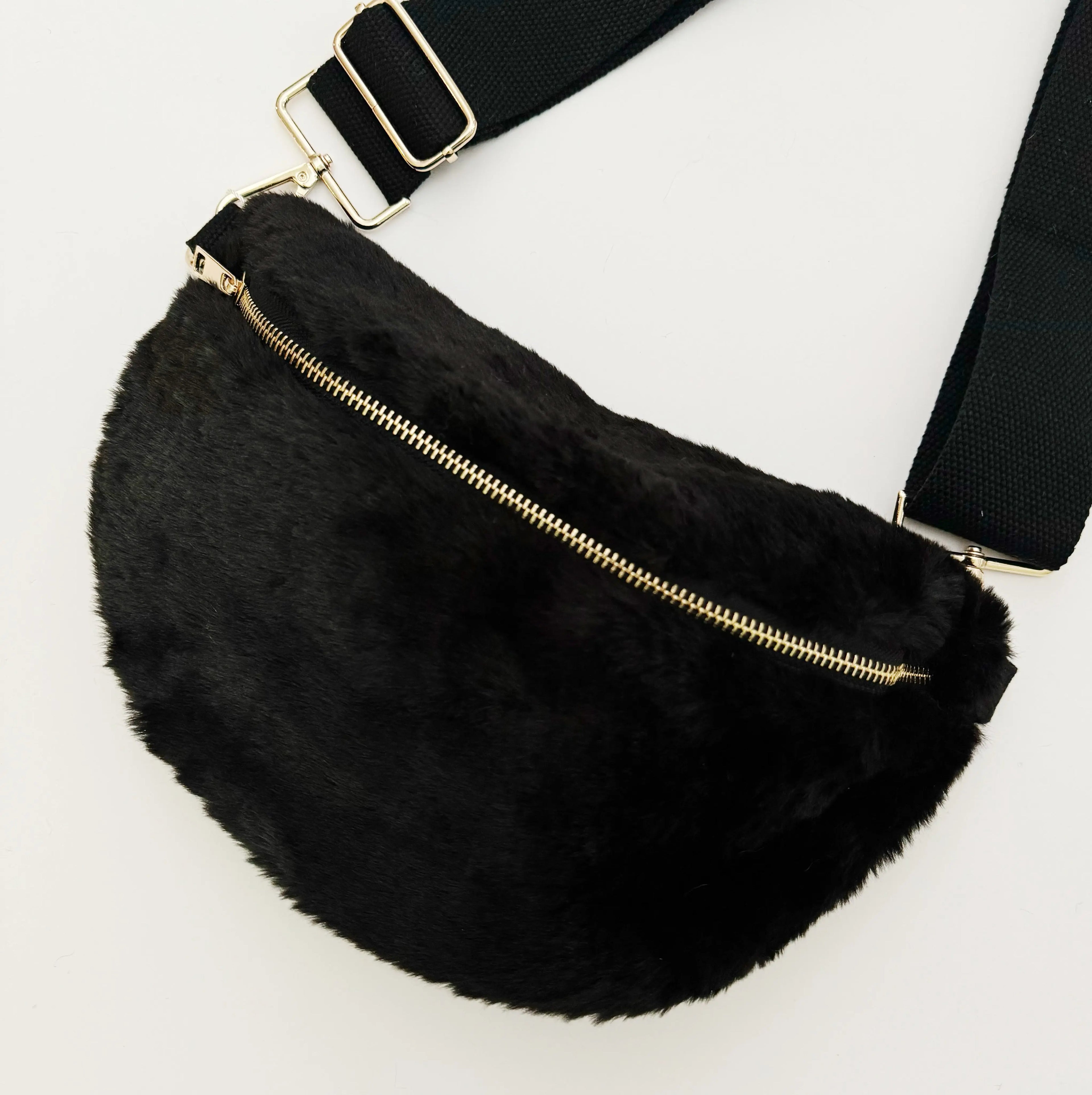 Kavon Buttery Bliss sling bag with golden hardware and custom lining, showcasing its soft leather texture and stylish design.