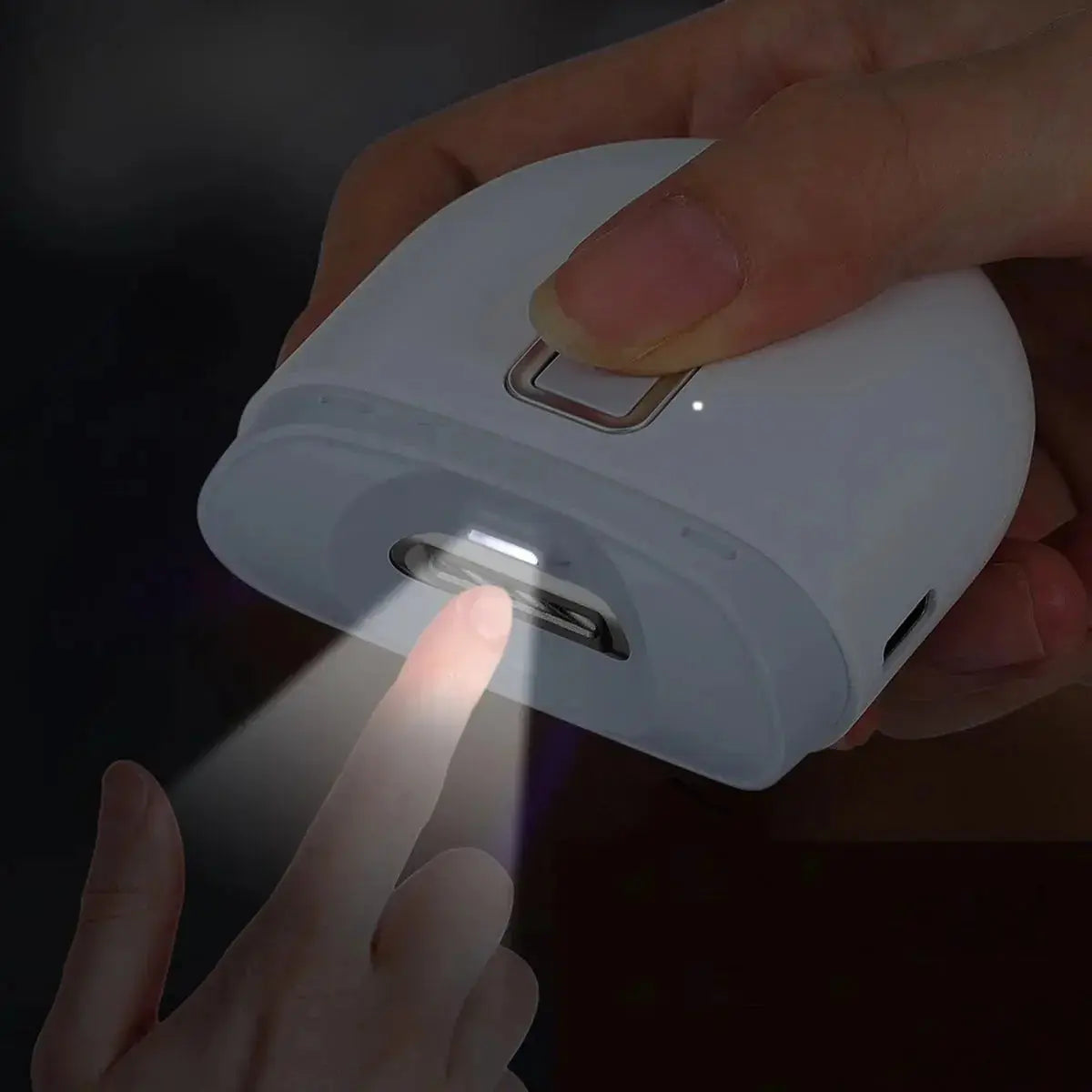 Kavon electric nail clipper with built-in light, cordless compact nail care tool for salon-quality buffing at home, shown in use.