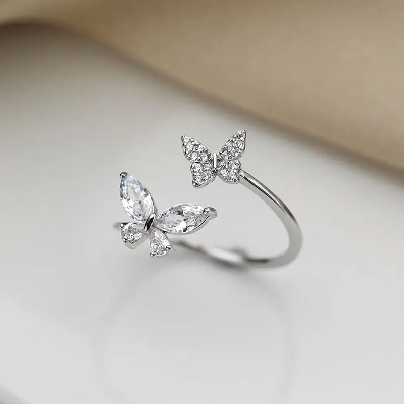 Sterling silver butterfly ring for women featuring an elegant statement design by Kavon, showcasing intricate butterfly details.