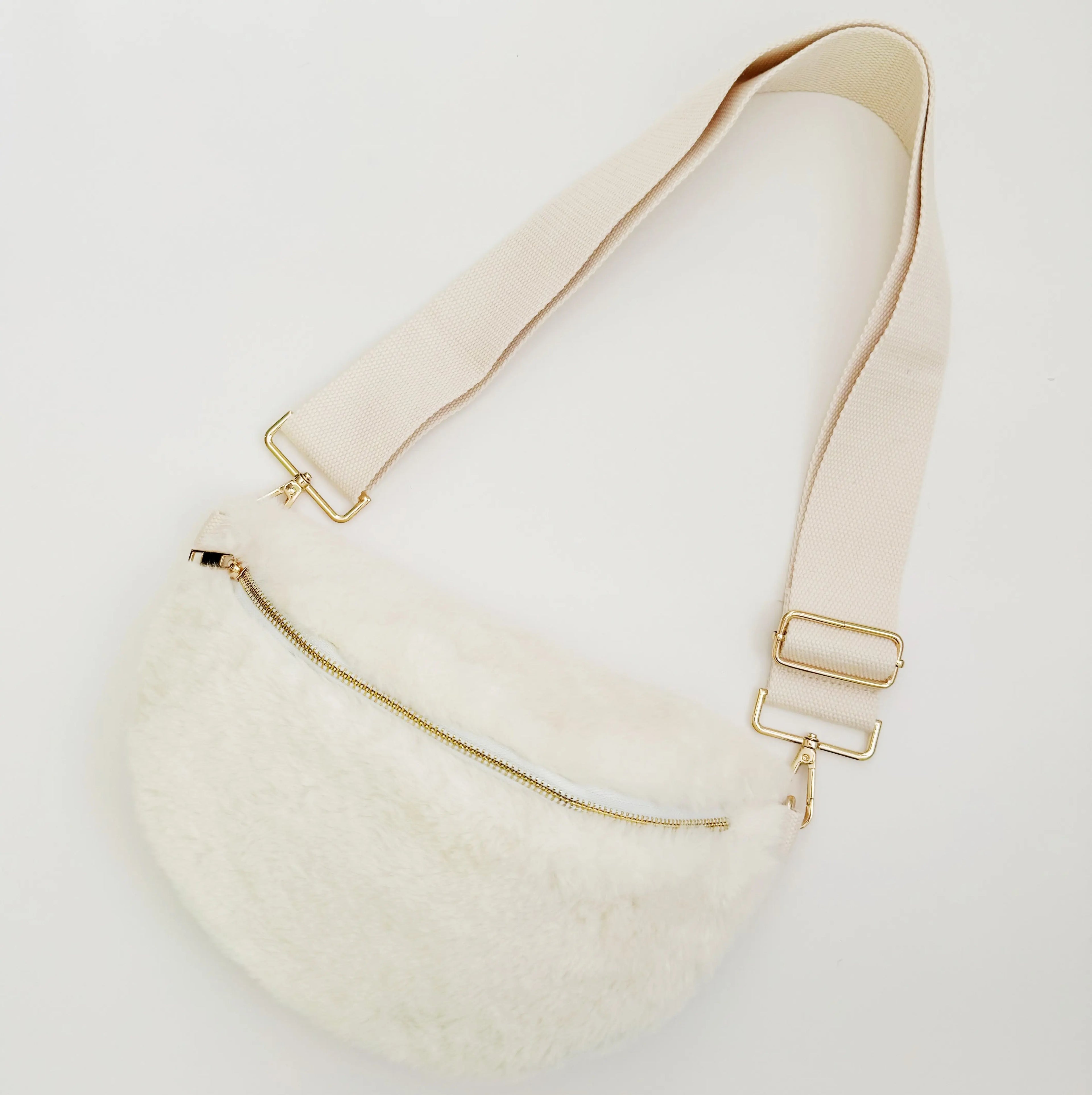 Kavon Buttery Bliss sling bag with golden hardware and custom lining, featuring a sleek design and compact silhouette.
