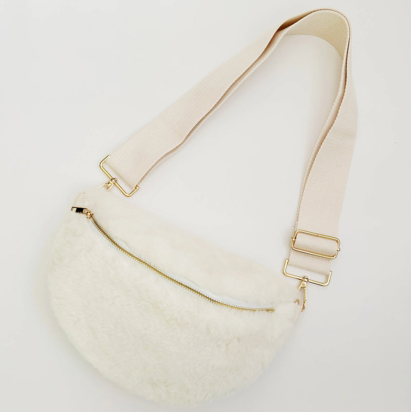 Kavon Buttery Bliss sling bag with golden hardware and custom lining, featuring a sleek design and compact silhouette.