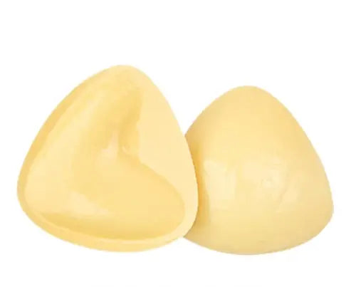 Kavon push-up adhesive bra inserts for lift and shaping, double-sided adhesive, shown in close-up with smooth silicone surface.