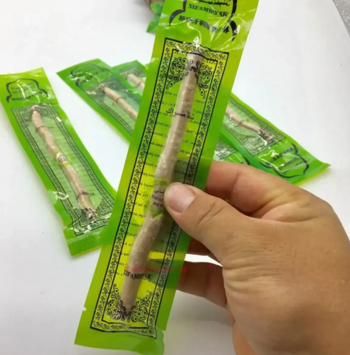 Kavon natural wood miswak tooth cleaning stick for eco-conscious travelers, used for everyday oral hygiene.