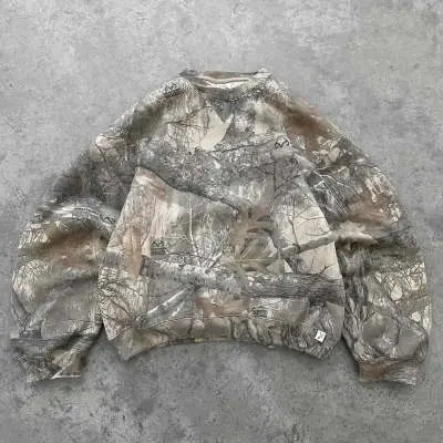 Kavon urban camo unisex oversized hooded sweatshirt with retro hip hop style and bold camouflage pattern.
