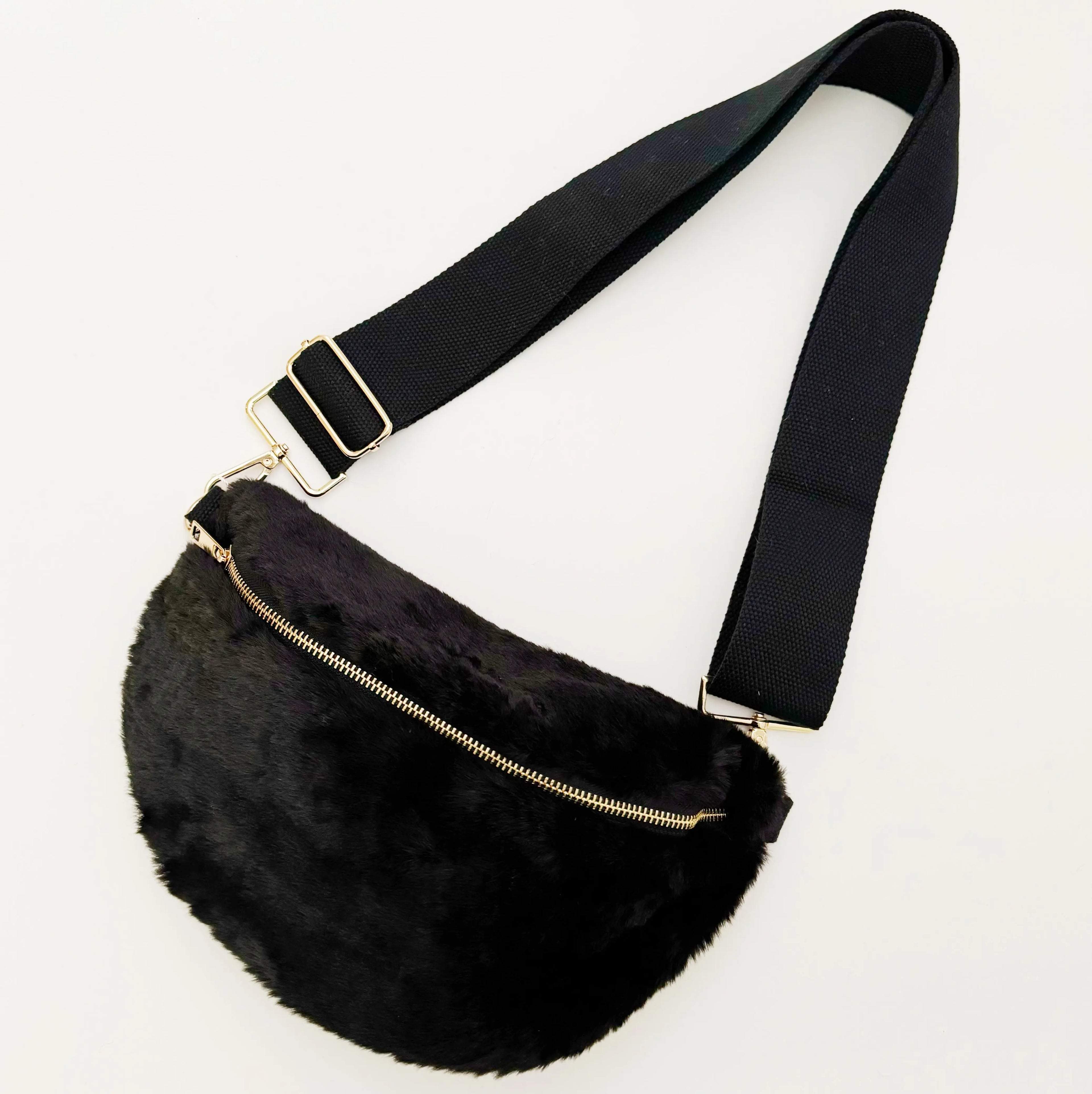 Kavon Buttery Bliss sling bag with golden hardware and custom lining, featuring a sleek design and soft buttery leather finish.