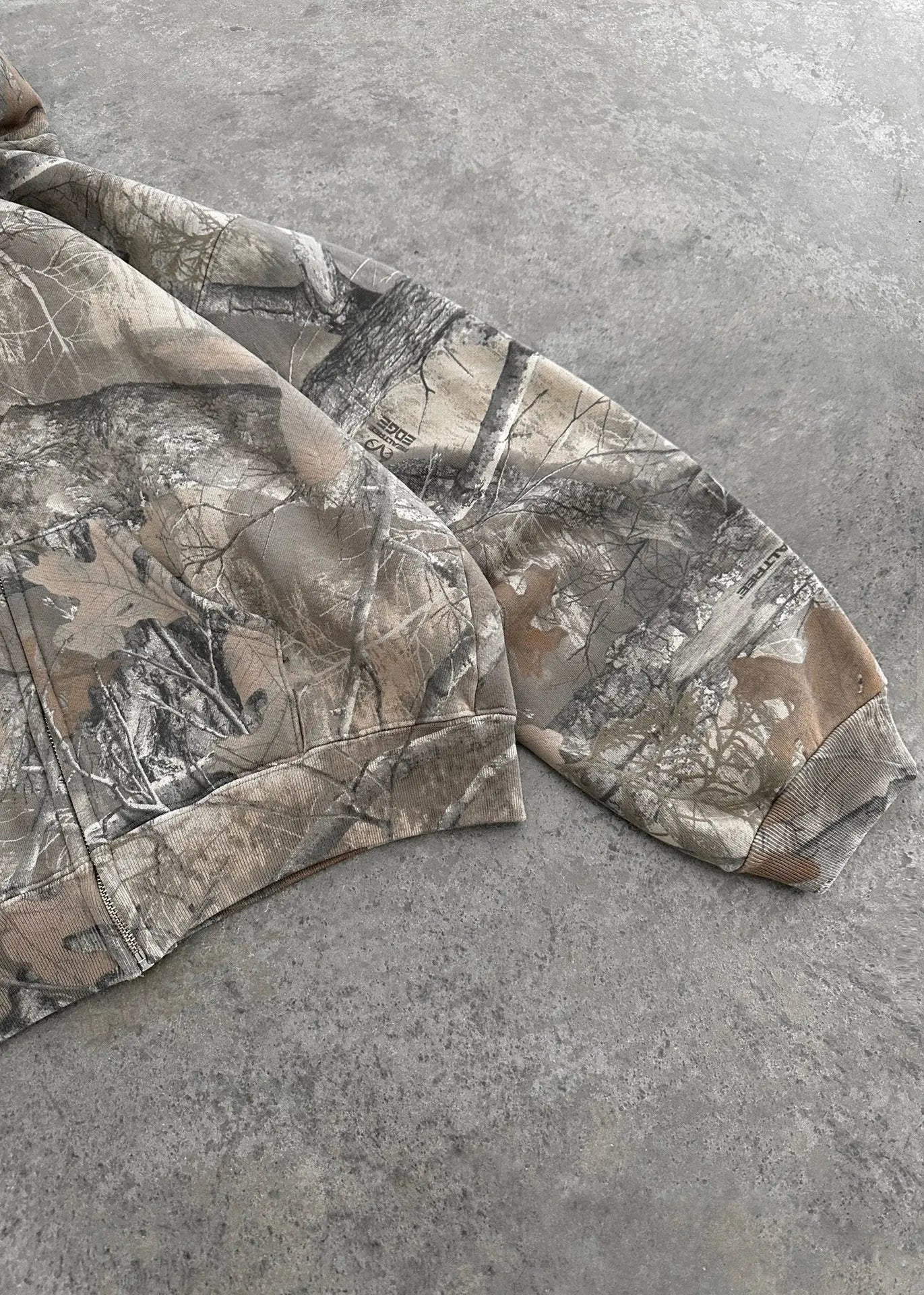 Kavon urban camo unisex oversized hooded sweatshirt with retro hip hop style, featuring bold camo print and a relaxed fit.