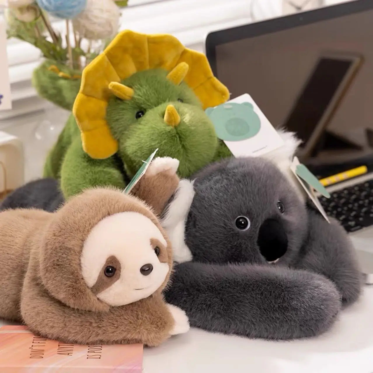 Kavon plush stuffed toys including panda, koala, sloth, dinosaur, bear, and small panda soft plush animals on a white background.